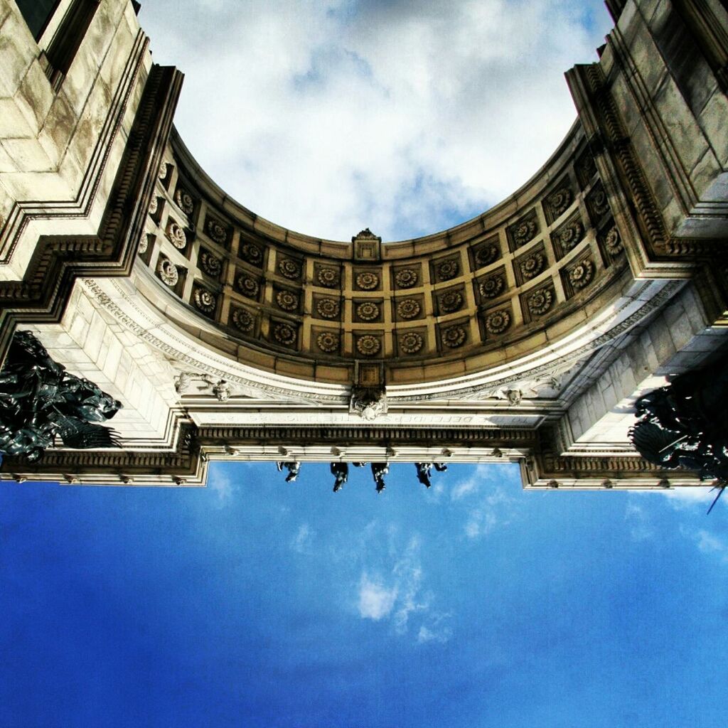 architecture, low angle view, built structure, building exterior, sky, famous place, history, travel destinations, cloud - sky, tourism, travel, day, capital cities, arch, international landmark, blue, facade, city, architectural feature, cloud