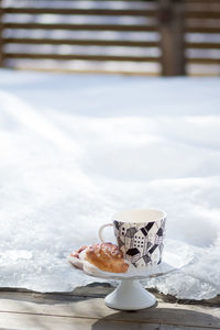 Close-up of coffee cup on table