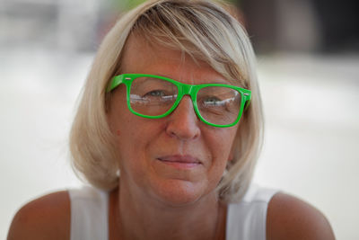 Close-up portrait of woman wearing eyeglasses