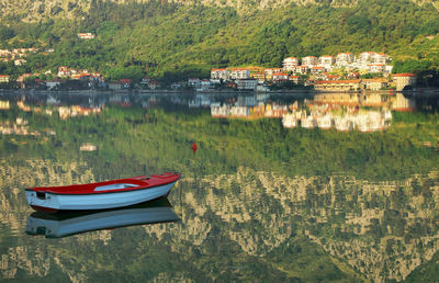 Boats moored at harbor