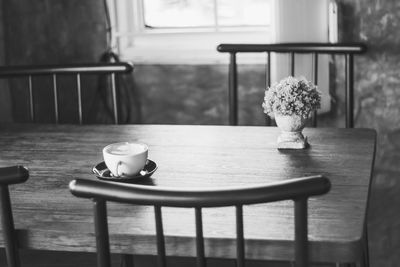 Close-up of coffee cup on table at home