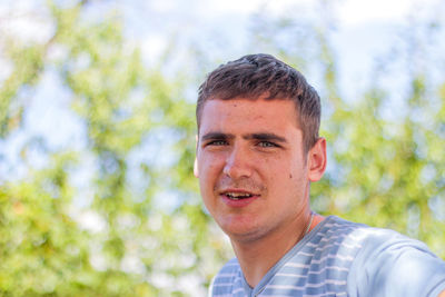 Portrait of young man looking away