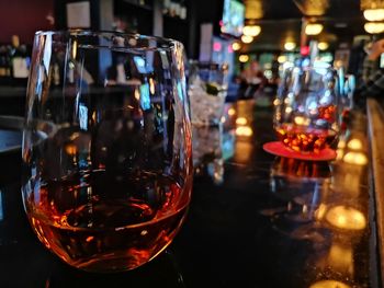 Close-up of drink in glass on table at bar