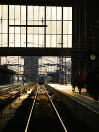 People waiting at railroad station