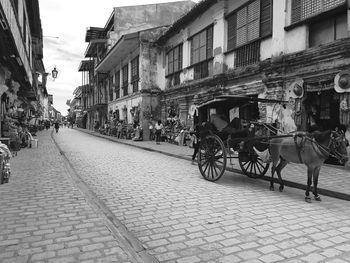 People walking on street in city