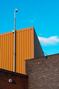 Low angle view of building against blue sky