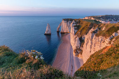 High angle view of sea against evening sky  to alabaster coast, Étretat, normandie, france.