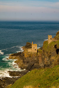 Scenic view of sea and coast against sky