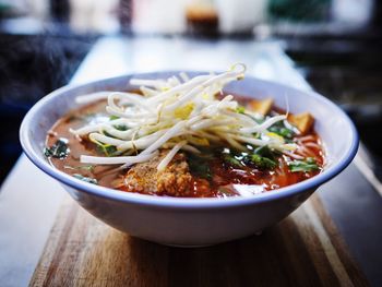 Close-up of hot soup served in bowl on table