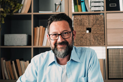 Portrait of smiling man at home