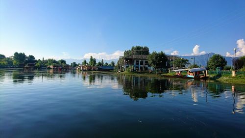 Scenic view of lake against blue sky