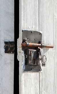 Close-up of key hanging in door