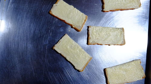 High angle view of bread on cutting board