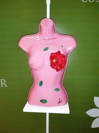 Close-up of pink art over black background