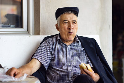 Portrait of man wearing hat