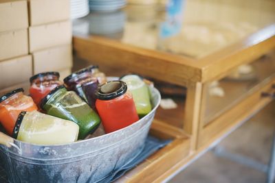 Close-up of various drinks in jars on table at cafe