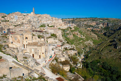 High angle view of townscape against clear blue sky