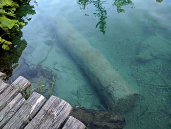 High angle view of rocks by lake