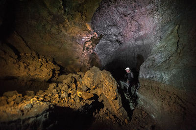 Man standing in cave