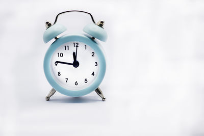Close-up of clock against white background