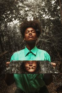 Portrait of boy looking away in forest