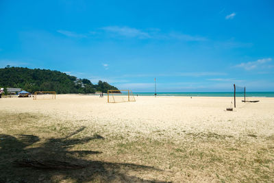 Scenic view of beach against blue sky