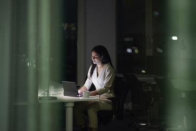 Woman working late in office