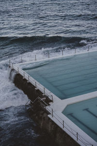 High angle view of swimming pool by sea