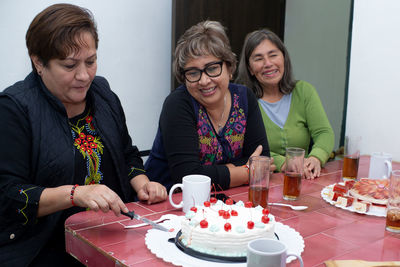 Friends having food at home