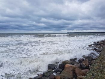 Scenic view of sea against dramatic sky