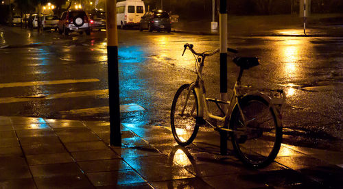 Bicycle on wet street at night