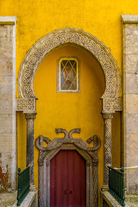 Closed door of yellow building