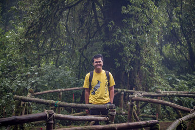 Portrait of young man in forest