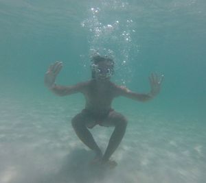 Man swimming in sea