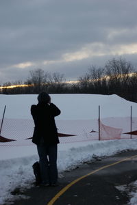 People standing on snow covered landscape