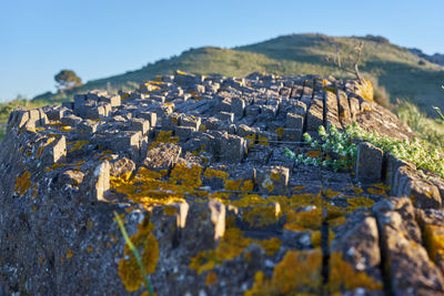 View of buildings in city against clear blue sky