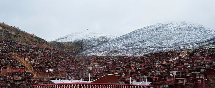 Aerial view of townscape against sky during winter