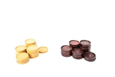 High angle view of coins on white background