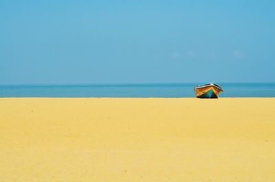 Scenic view of sea against blue sky