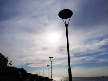 Low angle view of street light against sky