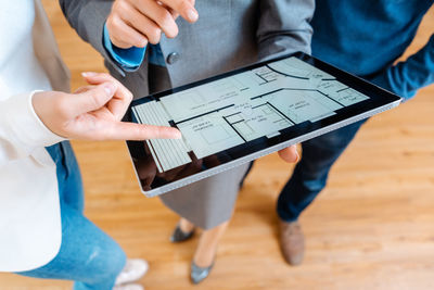 Midsection of man using laptop