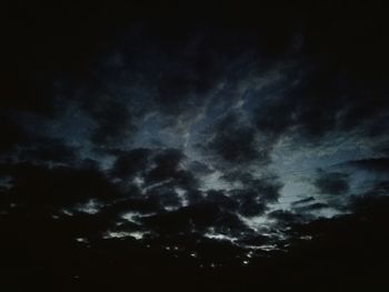 Low angle view of cloudy sky at night