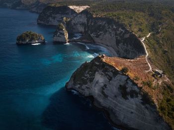 High angle view of rocks at sea shore