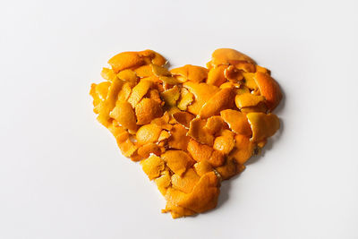 High angle view of heart shape against white background
