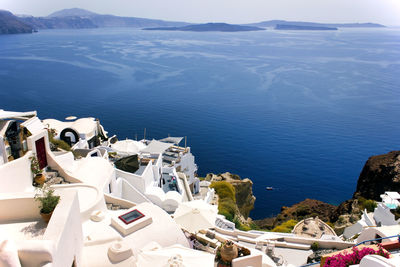 High angle view of sea and buildings against sky