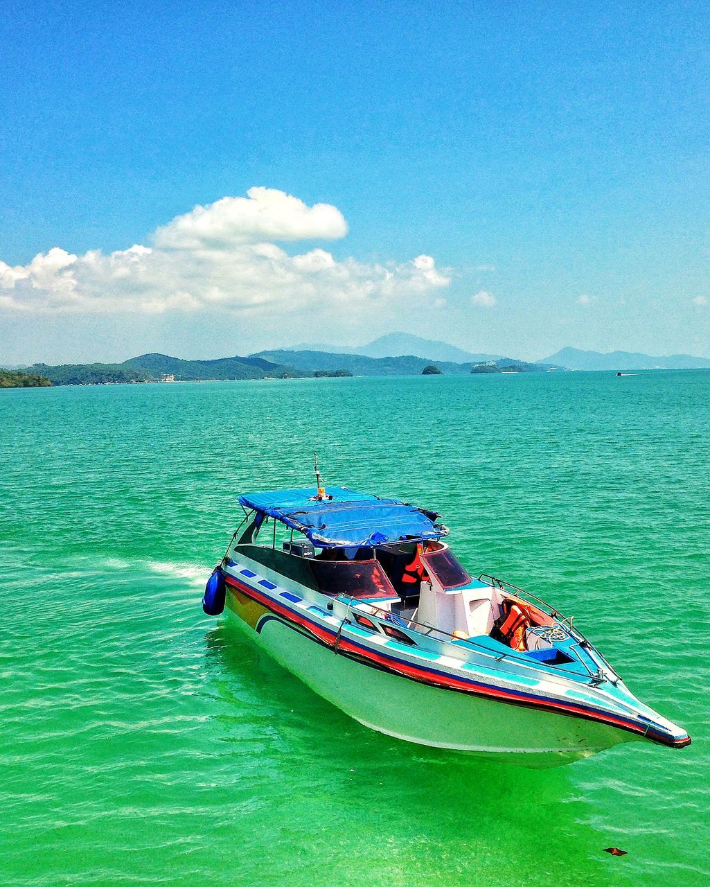 water, sea, nautical vessel, transportation, blue, boat, sky, mode of transport, tranquil scene, tranquility, beauty in nature, scenics, nature, waterfront, horizon over water, rippled, travel, day, idyllic, turquoise colored