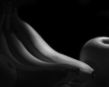 Close-up of hands against black background