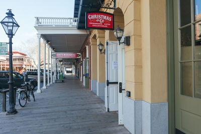 Text on footpath amidst buildings