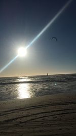 Scenic view of sea against clear sky at sunset