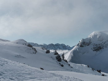 Scenic view of snowcapped mountains against sky